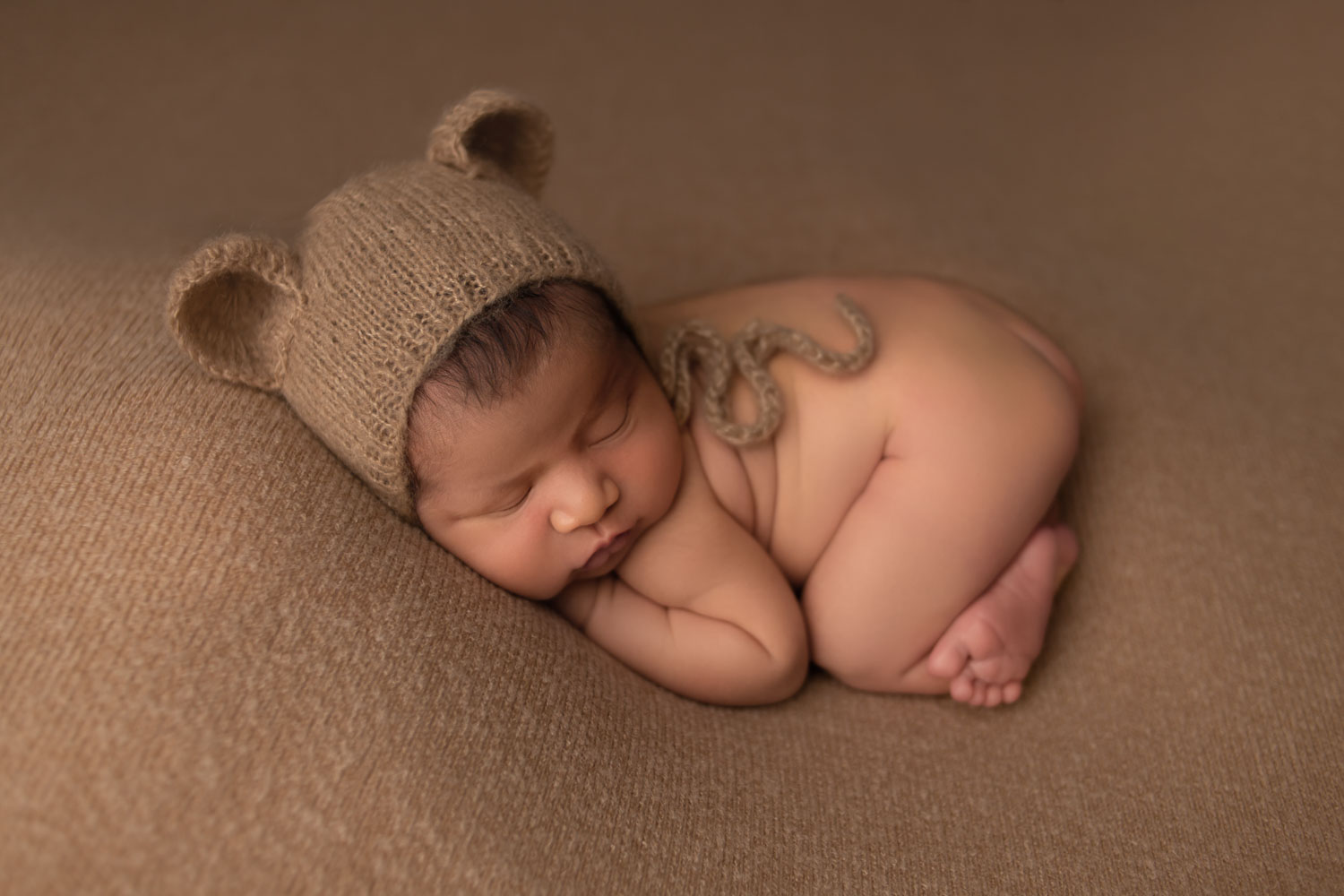 newborn boy with teddy bear hat posed photoshoot in fort lauderdale, fl