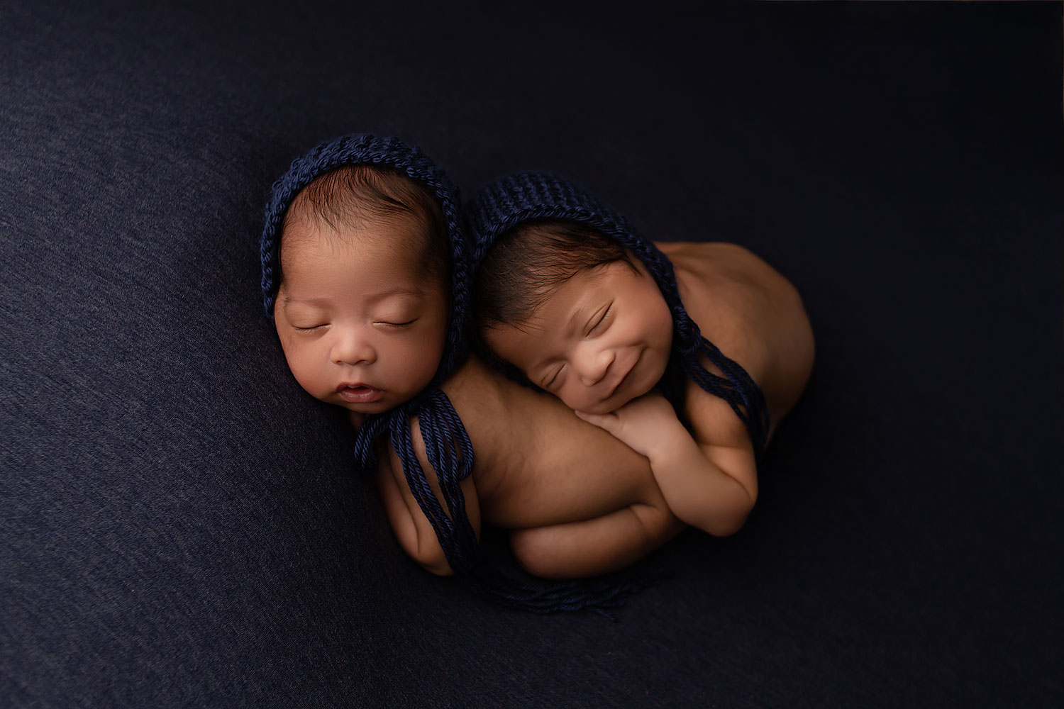 twin baby boys smiling for newborn session in cooper city, fl