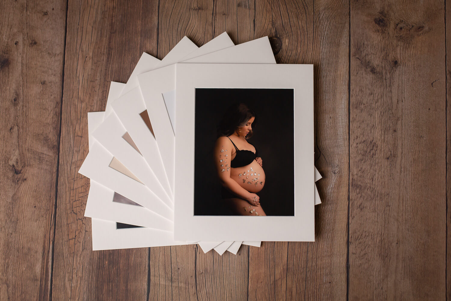 folio box with maternity and newborn photos
