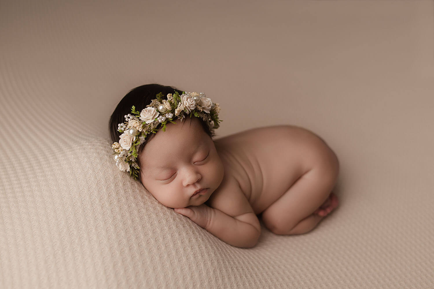 newborn posed with flower crown