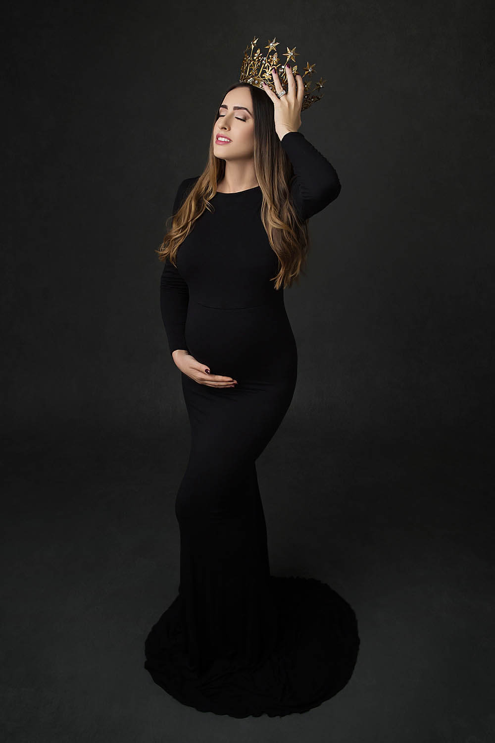 Pregnant woman in black dress with crown in cooper city, FL