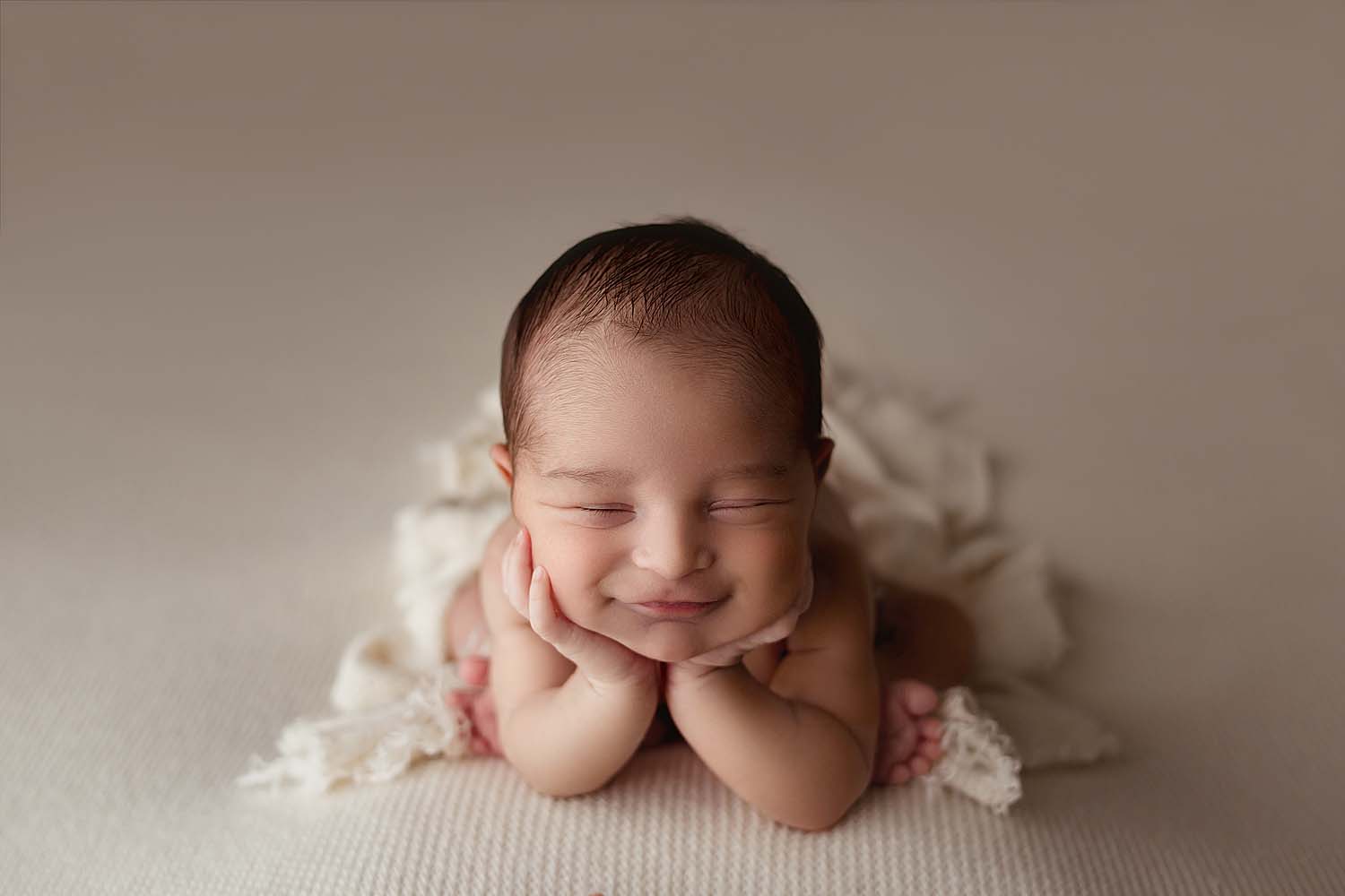 baby posed and smiling for newborn photos in cooper city, fl