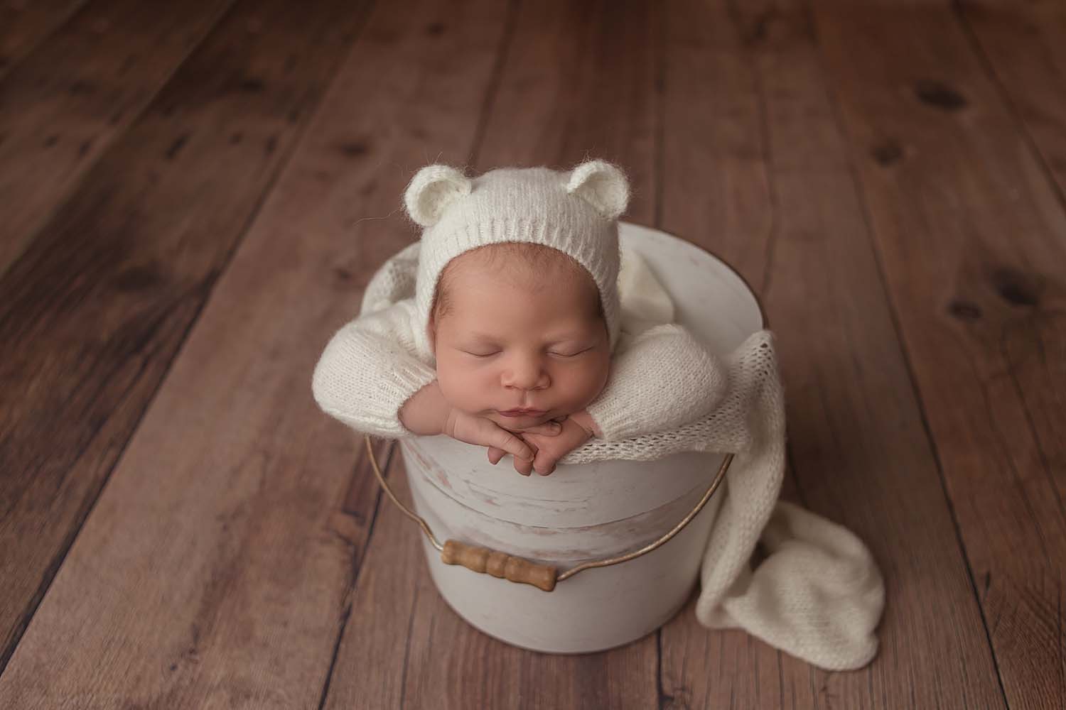 baby posed in bucket for newborn photos in cooper city, fl