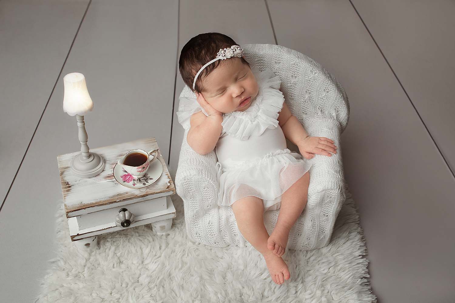 baby sitting in chair with coffee for newborn session in miami, FL