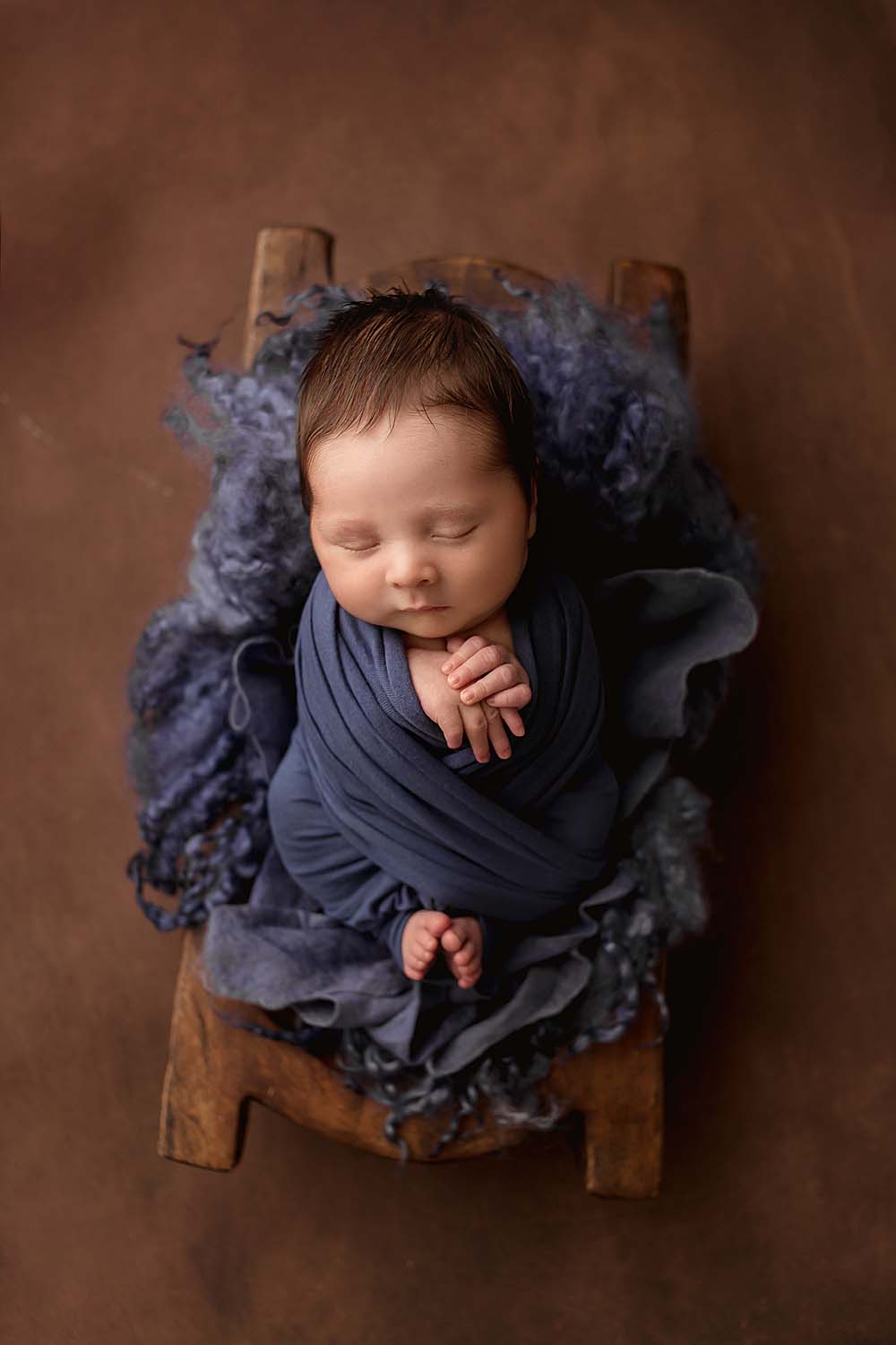 baby swaddled for newborn session in miami, FL