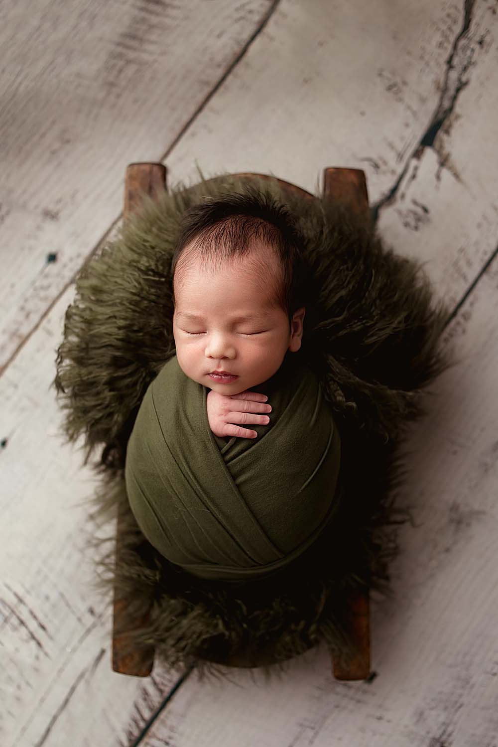 baby wrapped for newborn session in davie, fl