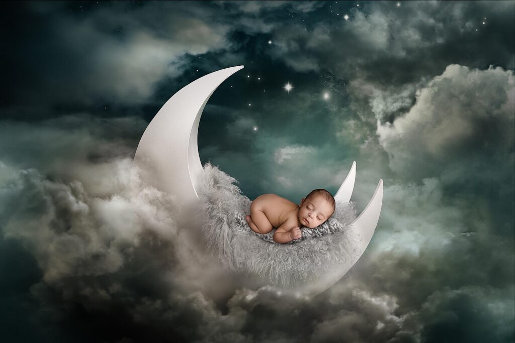 newborn baby posed on a moon prop for photography photoshoot in hollywood, FL