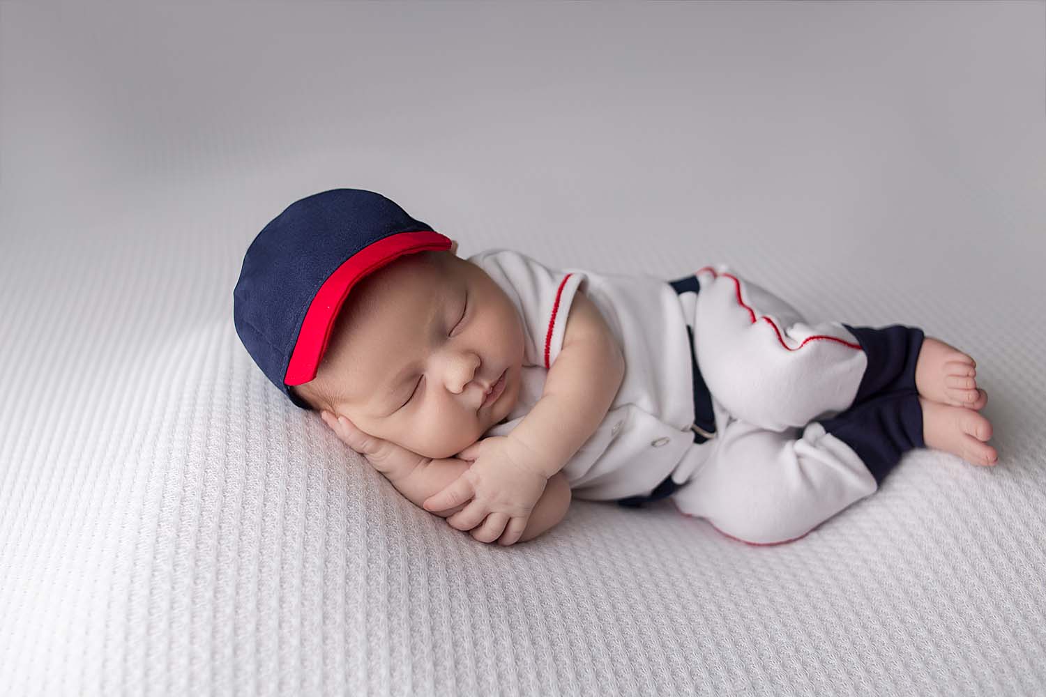 newborn in baseball outfit in plantation, FL