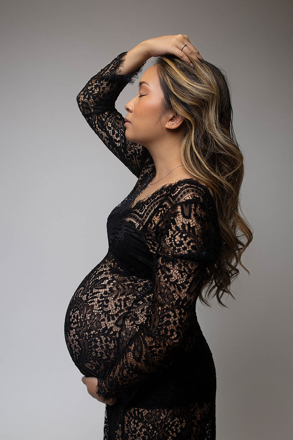 pregnant mom in black lace dress for maternity in plantation, FL