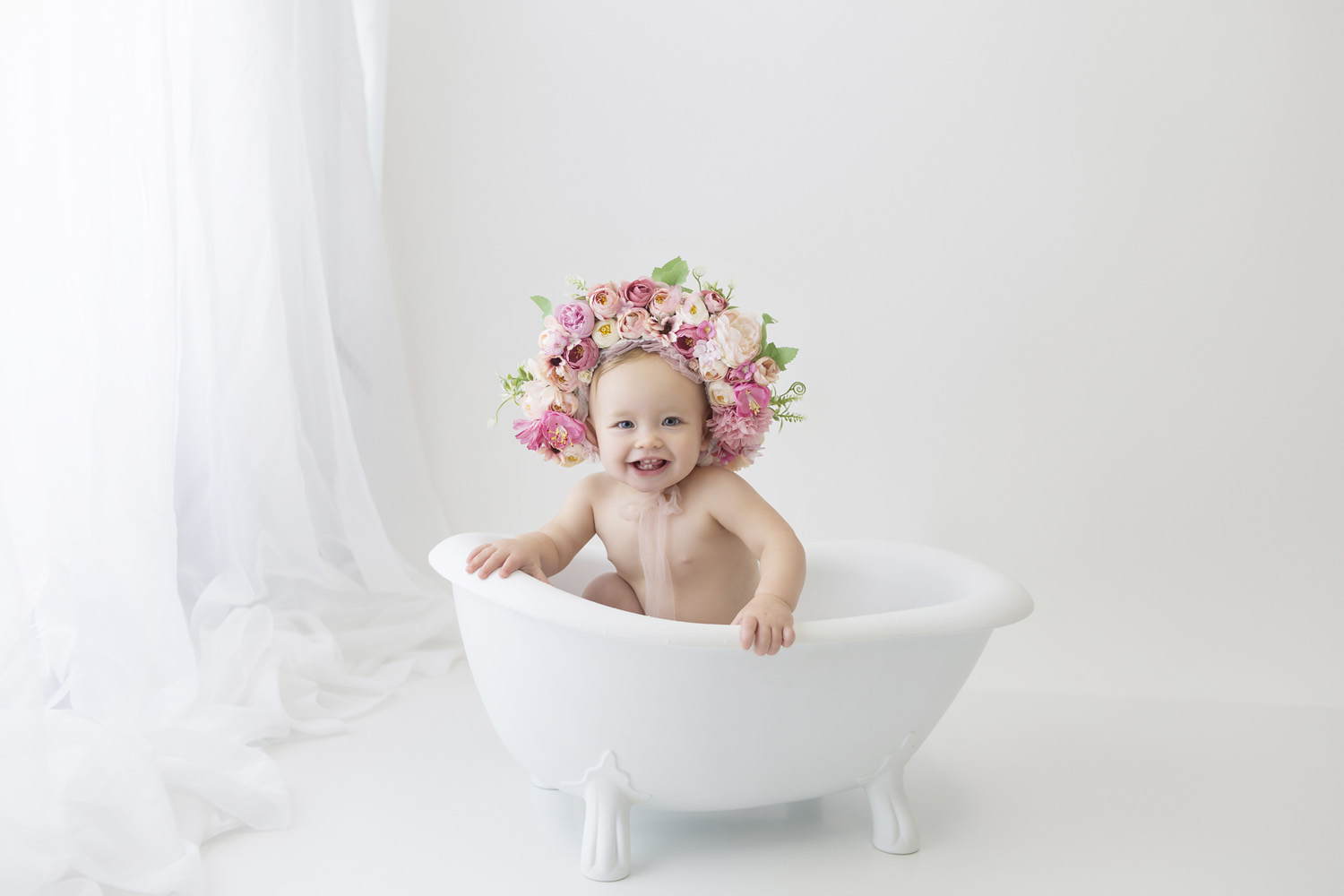 baby sitting in a tub for her one year milestone cake smash photography session in plantation, fl
