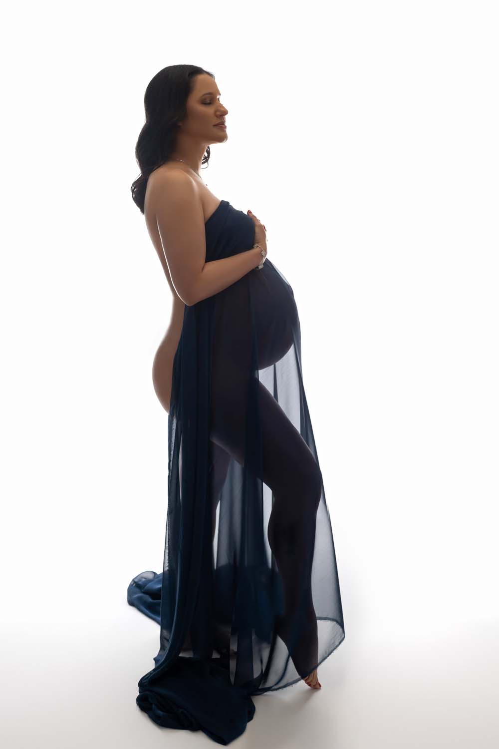 pregnant mom posed with draped fabric